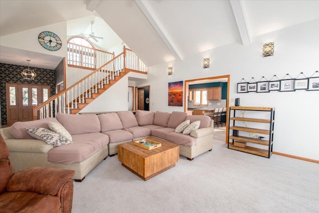 carpeted living room featuring high vaulted ceiling, beam ceiling, stairway, and baseboards