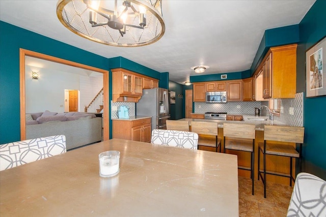 dining space with stairway and an inviting chandelier