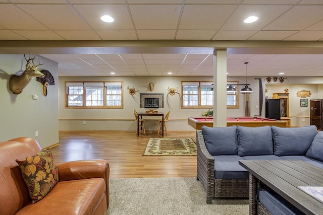 living room with baseboards, wood finished floors, pool table, a paneled ceiling, and recessed lighting