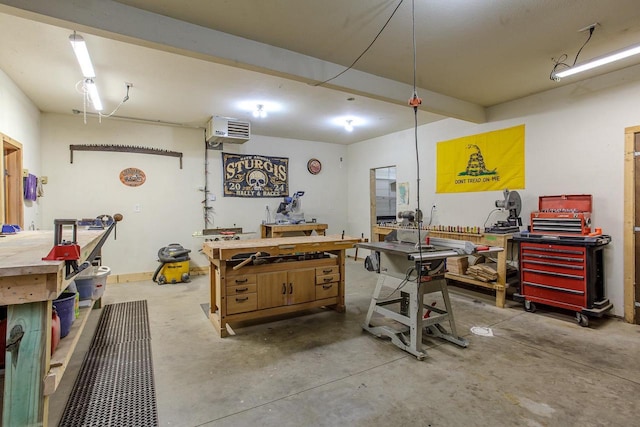 misc room featuring concrete flooring and a workshop area