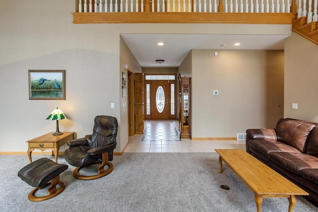 foyer entrance featuring light tile patterned flooring, recessed lighting, light colored carpet, visible vents, and baseboards