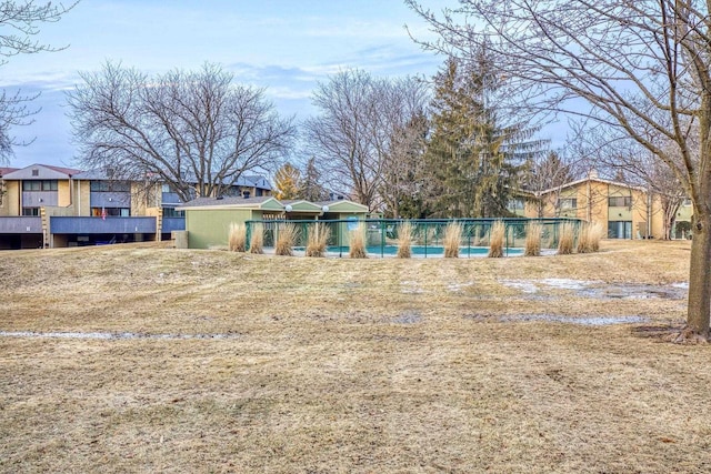 back of property with fence and a residential view