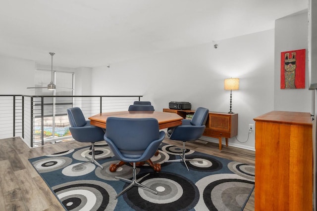 office area with ceiling fan and wood finished floors