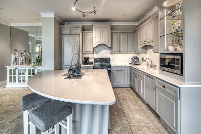 kitchen with custom exhaust hood, stainless steel microwave, gray cabinetry, a sink, and black range with electric cooktop