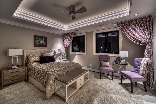 carpeted bedroom with baseboards, visible vents, a tray ceiling, and crown molding