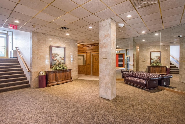 building lobby with stairs and visible vents