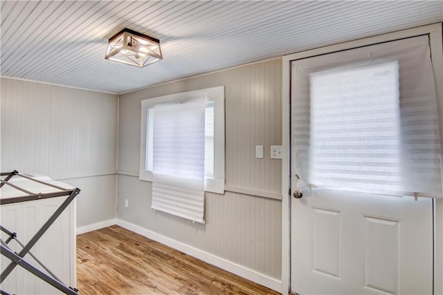 entryway with baseboards and light wood-style floors