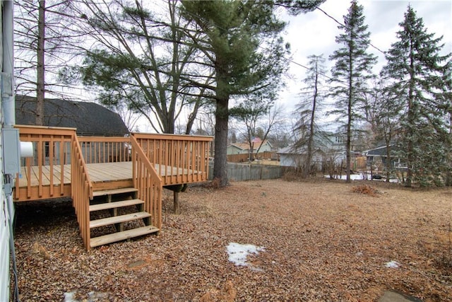 view of yard with fence and a wooden deck