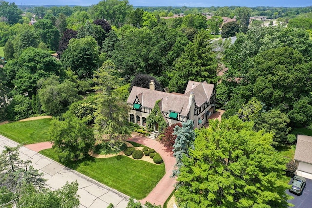 aerial view featuring a wooded view