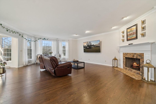 living room with a brick fireplace, ornamental molding, and dark wood-type flooring