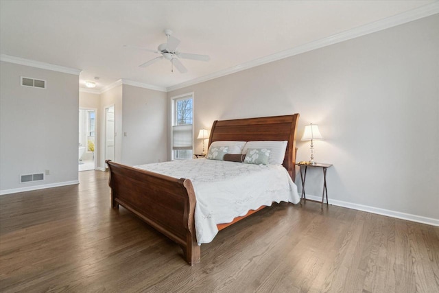 bedroom with baseboards, visible vents, and wood finished floors