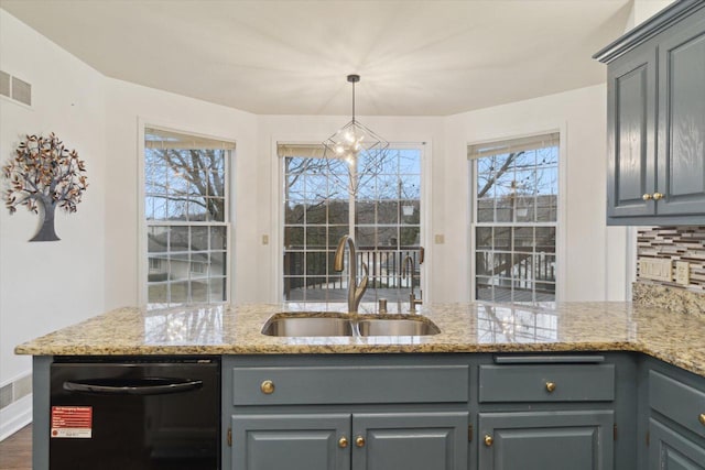 kitchen featuring dishwasher, tasteful backsplash, gray cabinets, and a sink