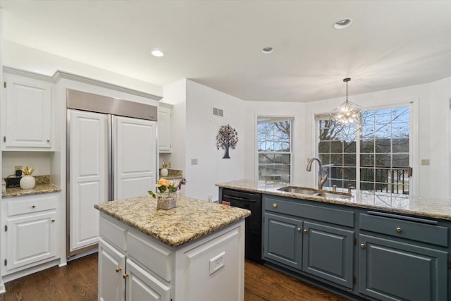 kitchen with dark wood-style flooring, a kitchen island, a sink, white cabinetry, and dishwasher