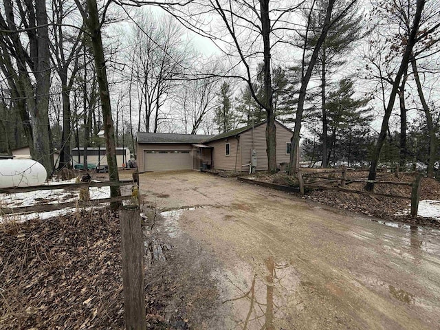 view of front of property with driveway and a garage