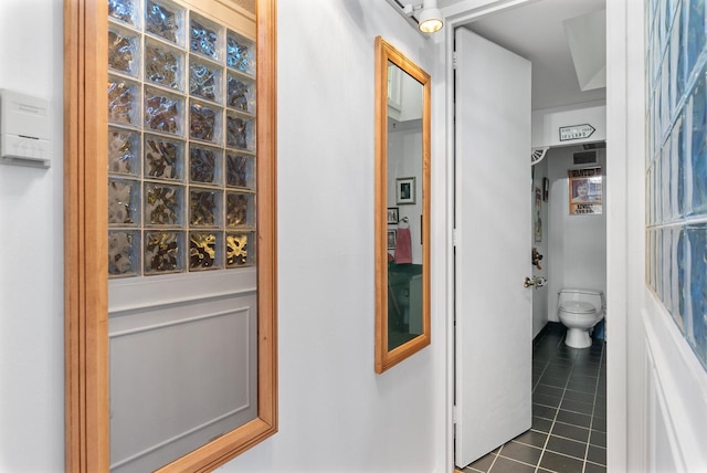 bathroom with tile patterned flooring and toilet