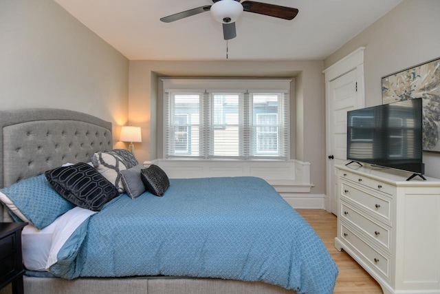 bedroom featuring ceiling fan and light wood finished floors