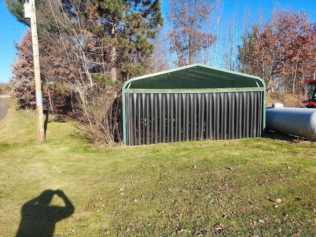 view of outbuilding featuring a carport