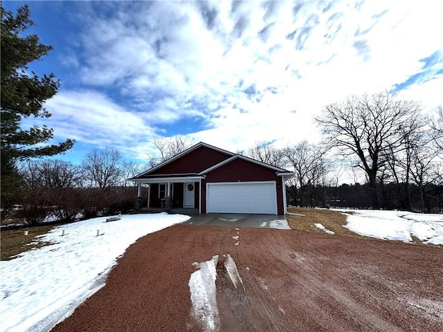 view of front of home with driveway and an attached garage