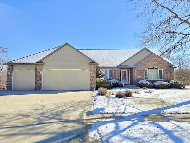 1700 Savannah Way, Waunakee, WI 53597 - ranch-style home featuring a garage, concrete driveway, and brick siding