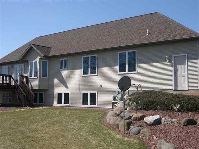 1700 Savannah Way, Waunakee, WI 53597 - back of property with a yard and stairway