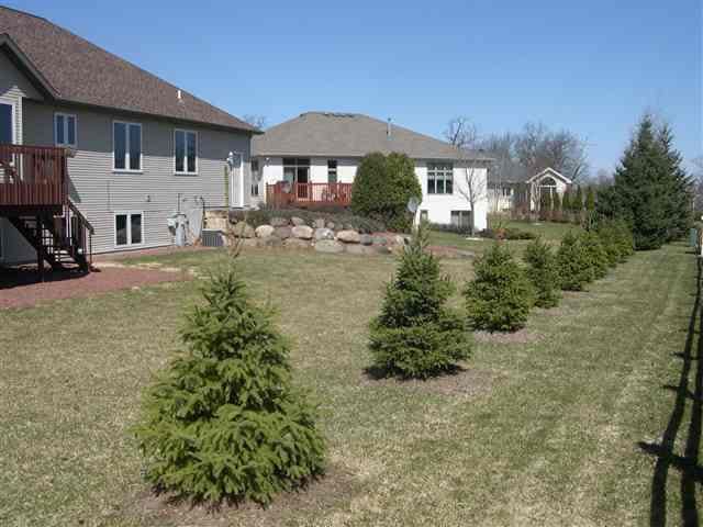 1700 Savannah Way, Waunakee, WI 53597 - view of yard featuring a wooden deck and stairs