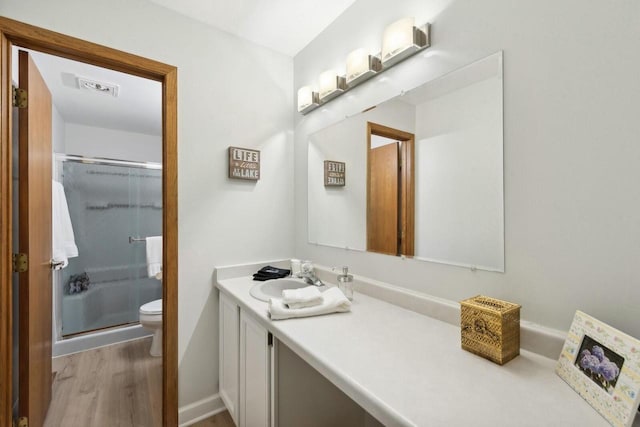 N2021 N Lake Shore Dr, Fontana, WI 53125 - full bath with a stall shower, vanity, toilet, and wood finished floors