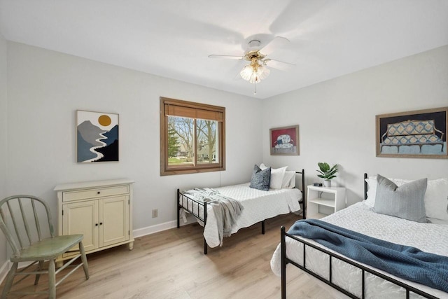 N2021 N Lake Shore Dr, Fontana, WI 53125 - bedroom with baseboards, ceiling fan, and light wood finished floors