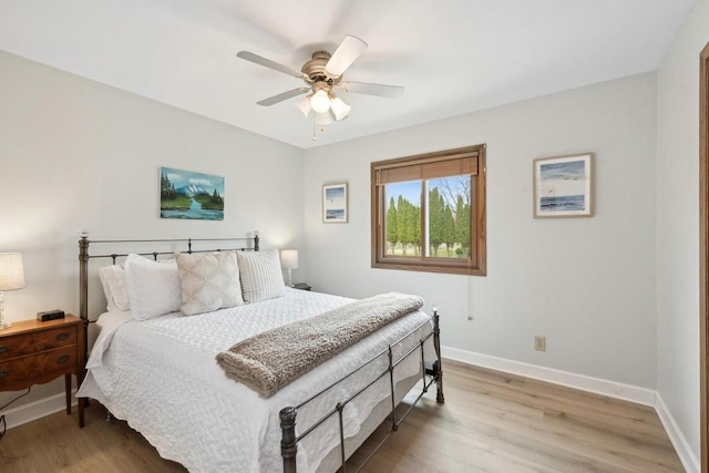 N2021 N Lake Shore Dr, Fontana, WI 53125 - bedroom featuring ceiling fan, baseboards, and wood finished floors