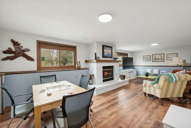 N2021 N Lake Shore Dr, Fontana, WI 53125 - office featuring a wealth of natural light, wainscoting, a fireplace, and wood finished floors