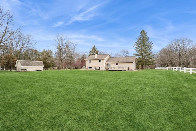 N2021 N Lake Shore Dr, Fontana, WI 53125 - view of yard featuring an outdoor structure, fence, and a wooden deck