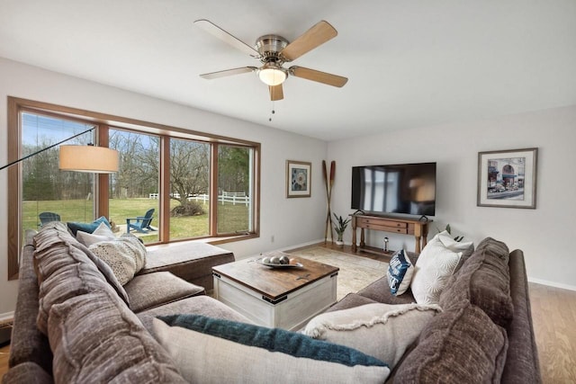 N2021 N Lake Shore Dr, Fontana, WI 53125 - living room with a ceiling fan, baseboards, and wood finished floors