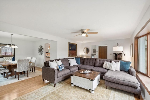 N2021 N Lake Shore Dr, Fontana, WI 53125 - living area featuring ceiling fan, light wood-type flooring, and baseboards