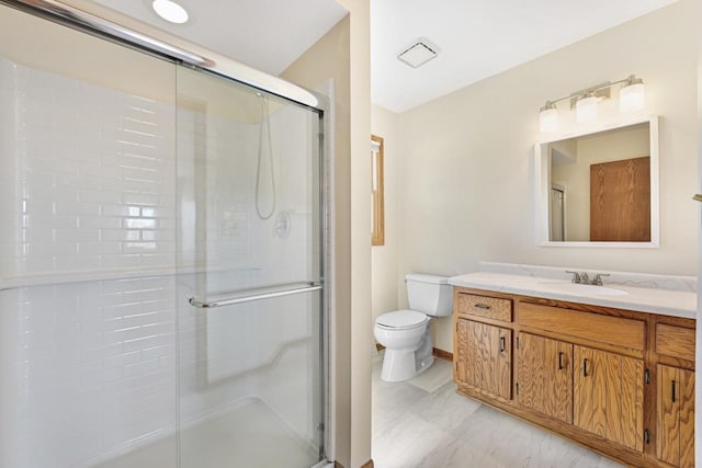 bathroom with toilet and a stall shower