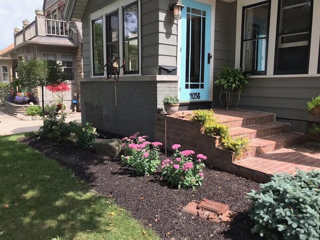 view of side of property featuring brick siding