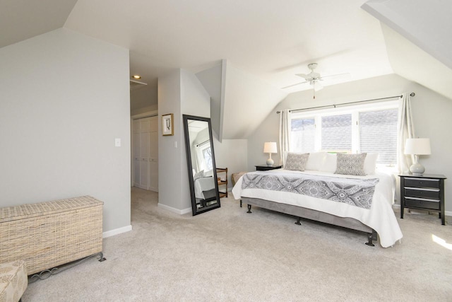 carpeted bedroom featuring lofted ceiling, a ceiling fan, and baseboards