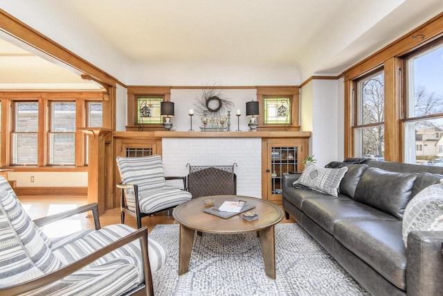 living area with wood finished floors and a fireplace