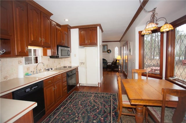 N7843 540th St, Menomonie, WI 54751 - kitchen with decorative backsplash, light countertops, crown molding, black appliances, and a sink