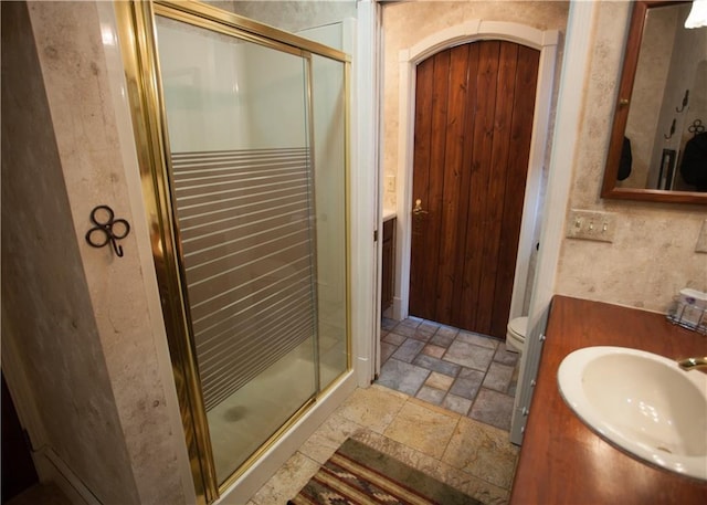N7843 540th St, Menomonie, WI 54751 - full bathroom with a shower stall, stone tile floors, and vanity