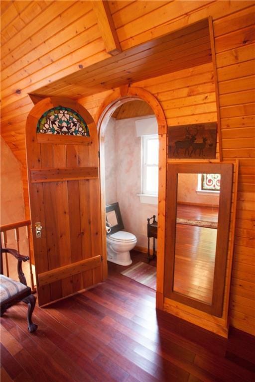 N7843 540th St, Menomonie, WI 54751 - bathroom with toilet, wood walls, wood ceiling, and wood finished floors