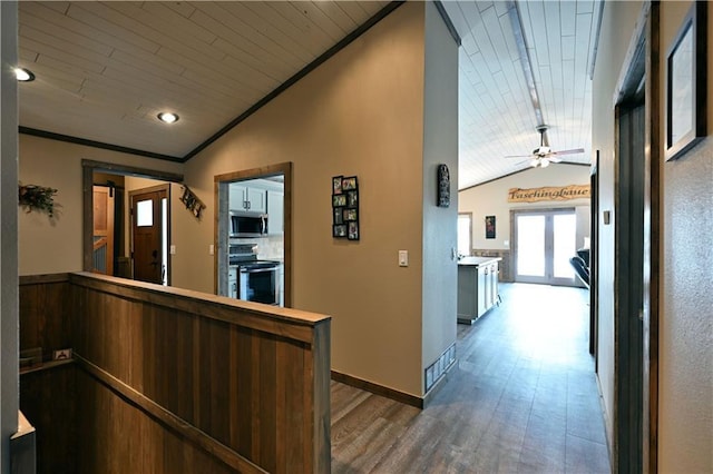 interior space with vaulted ceiling, wood finished floors, and wood ceiling