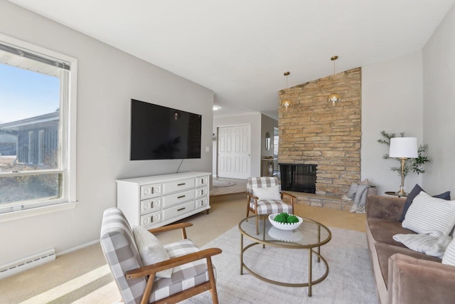 carpeted living room featuring a baseboard heating unit, a healthy amount of sunlight, baseboards, and a fireplace