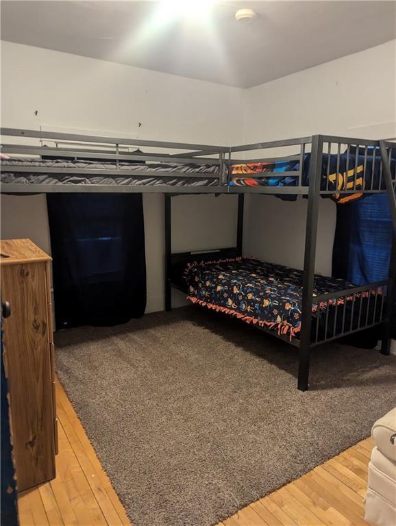 bedroom featuring wood-type flooring