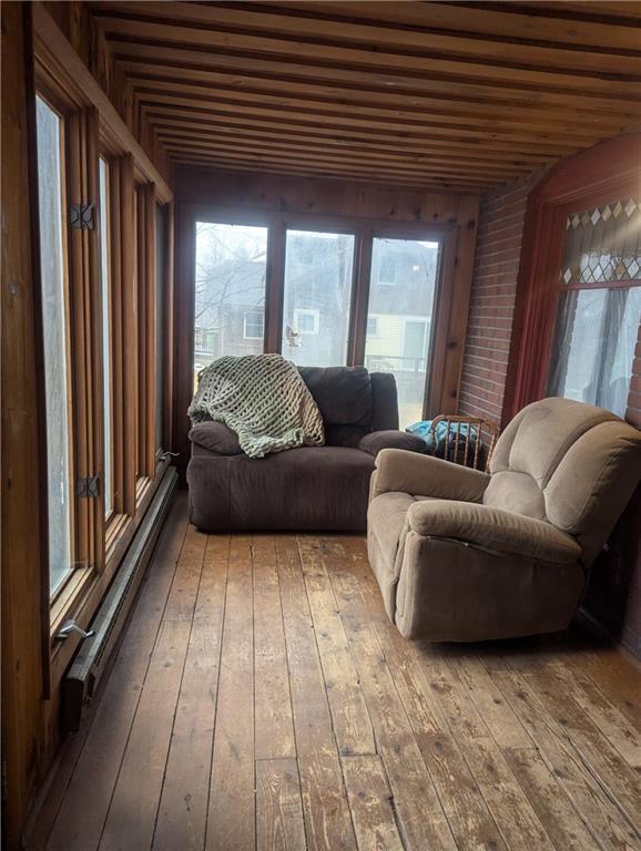 interior space featuring a wealth of natural light and hardwood / wood-style floors