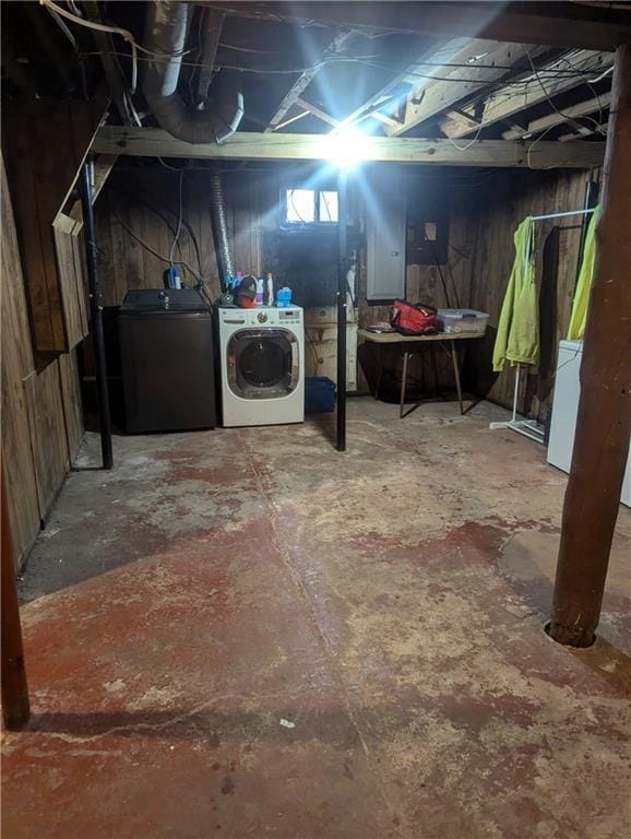 unfinished basement with washing machine and dryer