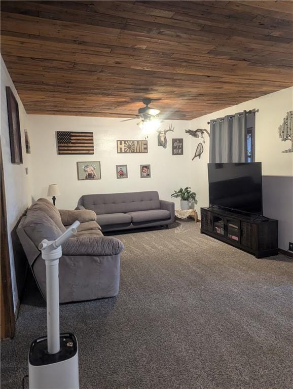 living room with carpet floors, wooden ceiling, and a ceiling fan