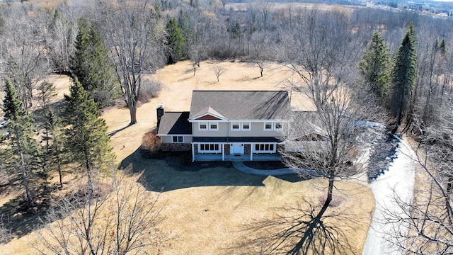 drone / aerial view featuring a view of trees