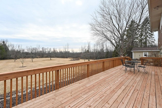 wooden deck featuring outdoor dining area