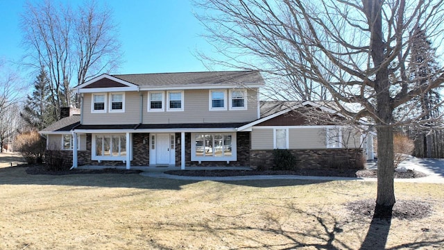 view of front of house featuring a front lawn and a porch