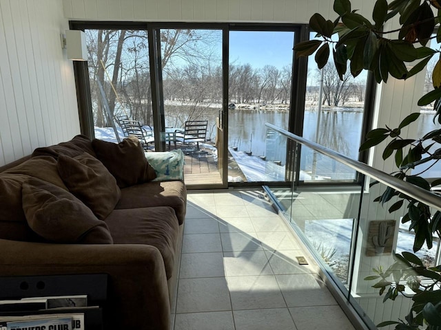 sunroom / solarium with a water view