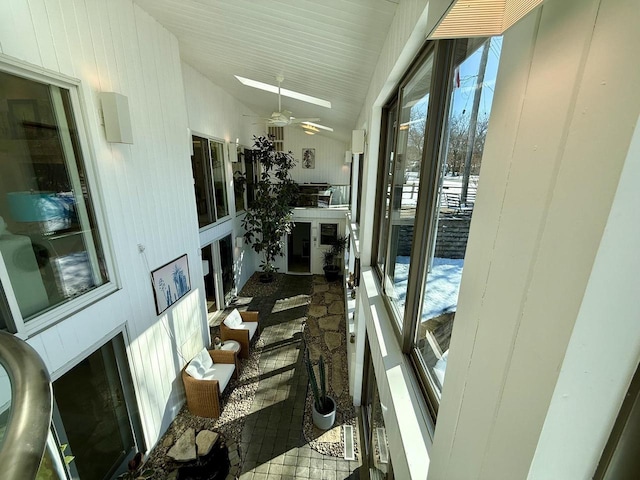 sunroom with vaulted ceiling and ceiling fan